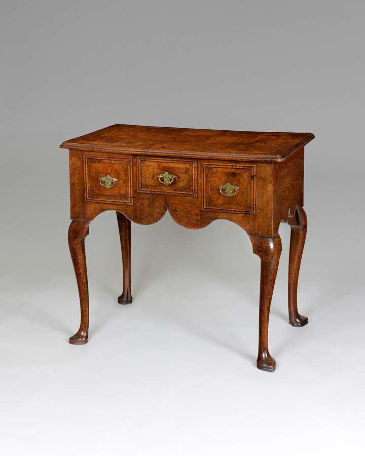 A very good Queen Anne period veneered walnut lowboy